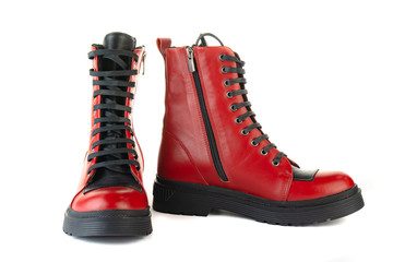 Women's red shoes from a varnish on a white background