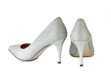 Women's red shoes from a varnish on a white background