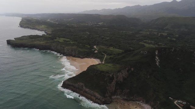 Beach in Asturias. Coastal landscape in Cue, beach of Llanes. Spain. Aerial Drone Footage