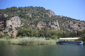 Boat excursion along the Dalyan River in Turkey to the ancient Lycian rock tombs.