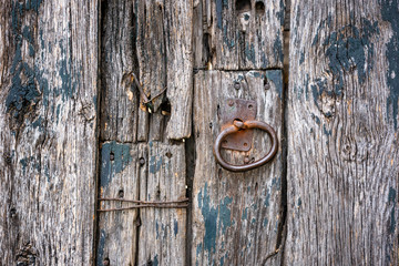 Weathered And Derelict Door Section With Rusted Latch