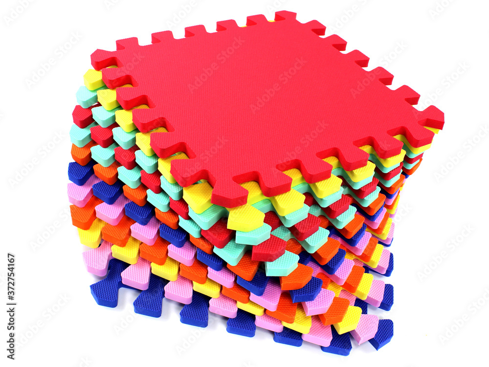 Fototapete puzzle mat - multicolored soft elements letters and numbers on a white background