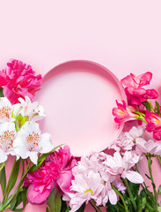 Fototapeta premium Floral circle frame banner in pastel pink color. Space for text. Place for text. Pink and white flowers flatlay. Greeting card for birthday. Romantic wedding invitation . High quality photo