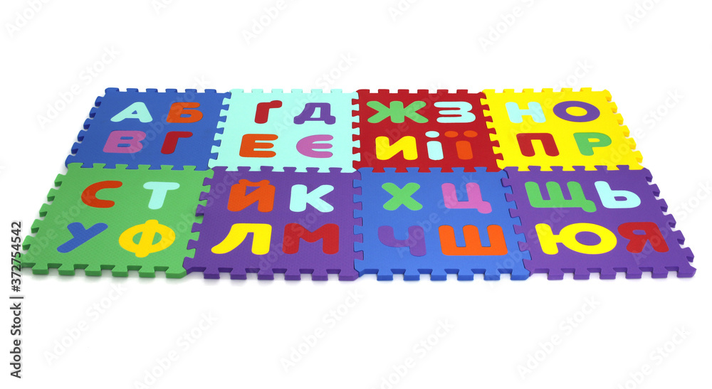 Fototapete puzzle mat - multicolored soft elements letters and numbers on a white background