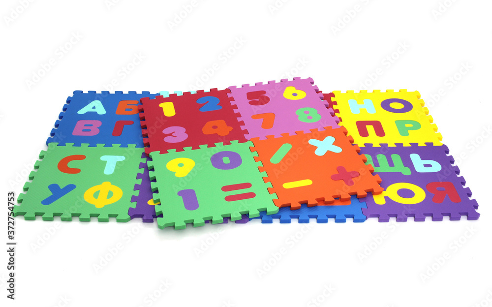 Fototapete puzzle mat - multicolored soft elements letters and numbers on a white background