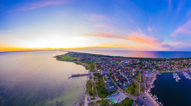 Beautiful Panorama color sky, sunset by the Baltic Sea, Jastarnia, Poland. Harbor. Aerial View