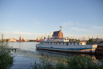 view of the port of Kaliningrad on a summer evening at sunset