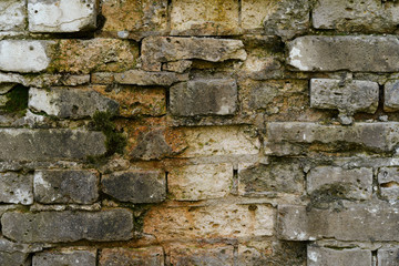 crumbling bricks in an old destroyed wall background