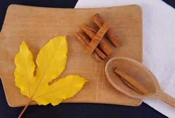 Fototapeta na wymiar Cinnamon sticks on wooden board. 