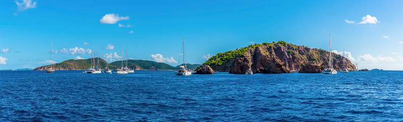 Fototapeta na wymiar A panorama view sailboats moored of the Pelican Island and the Indian Islets off the main island of Tortola