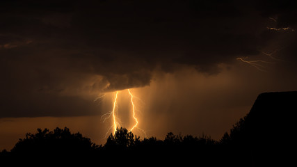 Lightning strikes during a dramatic sunset