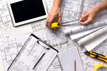 architect design working drawing sketch plans blueprints and making architectural construction...
