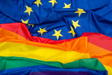 Fabric European Union EU and Rainbow flags, concept picture about human rights