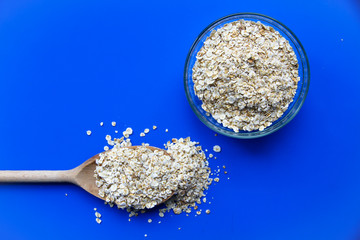 Oatmeal in a wooden spoon.