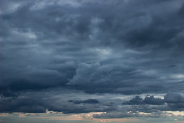 Fototapeta na wymiar Cloudy sky with dark blue heavy clouds. Dark blue dramatic sky background.