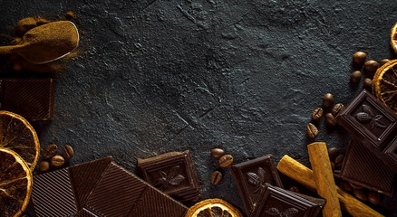 Chocolate chunks on a dark background, copy space.