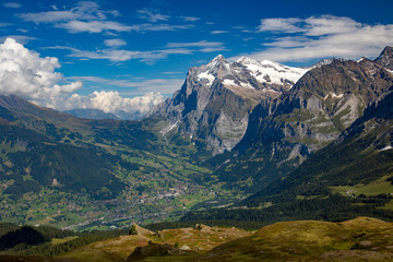 A high angle view of  the village of Grindelwald and the Wetterhorn in the Swiss Alps.