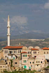 View over the ancient houses and cave dwellings in the town Ortahisar, Cappadocia, Turkey