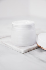 Beauty Cosmetic Cream Jars On Marble