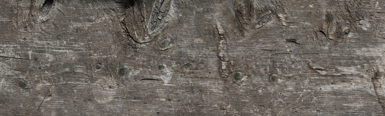 Background of aged grunge dark natural wood board texture. Backgroud banner. Top view