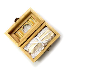 Isolated wooden jewelry box for rings on white background wedding celebration space for text
