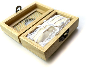 Open wooden ring box for wedding on white background