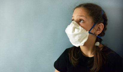 Beautiful girl in a medical mask against bacteria and viruses.