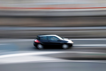Fototapeta na wymiar Driving fast in a highway