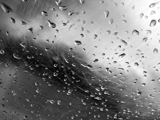 water droplets on the surface of stainless steel