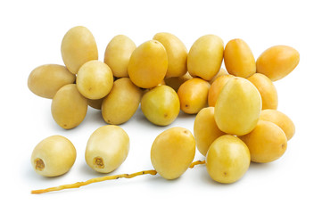 Fresh yellow dates fruits isolated on white background, clipping path included.