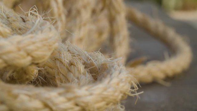 Jute rope extreme close-up. Natural eco-friendly materials for handcrafted. Macro shooting, camera slowly moving on slider.