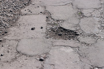 Highway with holes on Ukrainian roads, broken asphalt