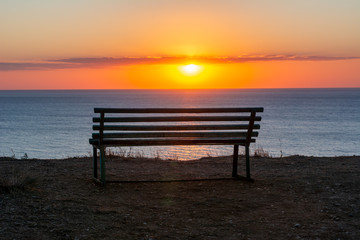 Fototapeta na wymiar Bench with sea view at sunset, Sicily island, Italy