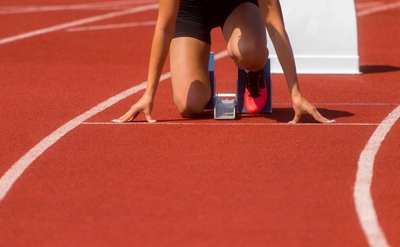 Runner In Start Position Prepares For The Start. Individual Sport Conept