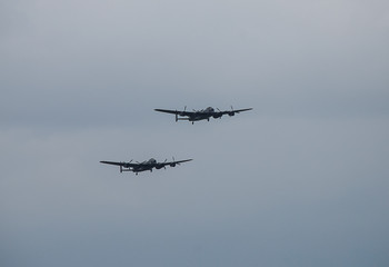 Fototapeta na wymiar The last two remaining airworthy Avro Lancasters heavy bombers performing a duet in the skies