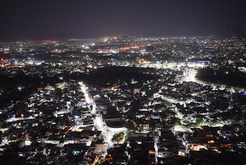Naklejka premium City night view from Shri Manshapurna Karni Mata temple for city - Udaipur India.