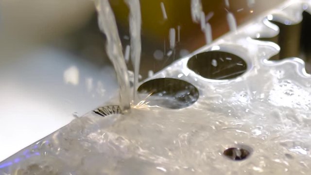 Slow motion: wire cutting machine working with sheet metal with sparks at factory, exhibition, plant. Metalworking, industrial, machining, technology, manufacturing, equipment concept