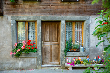 Fototapeta na wymiar Floral decorations on a home in Lauterbrunnen, Switzerland.