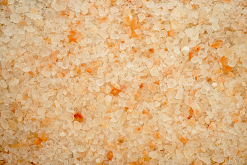 white-yellow-orange crystals of Himalayan coarse salt as a background