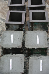 MALACCA, MALAYSIA -JUNE 18, 2016: Cube test. Steel mold in cube shape filled with concrete to get standard cube shape concrete block. The block will be used for compression test in laboratory. 
