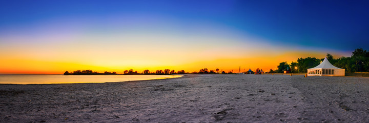 Sunset at the IJsselmeer with the beach of Makkum