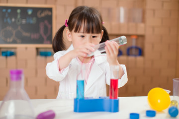 young  girl  play science experiments for homeschooling