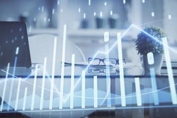 Double exposure of financial graph drawing and office interior background. Concept of stock market.