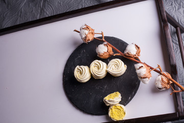 handmade marshmallow in the form of roses in a gift box close-up.