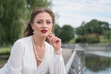 Fototapeta premium Outdoor summer fashion portrait of young elegant lady, Gorgeous young model