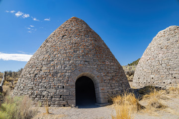 Sunny exterior view of the huge oven of Ward Charcoal Ovens State Historic Park