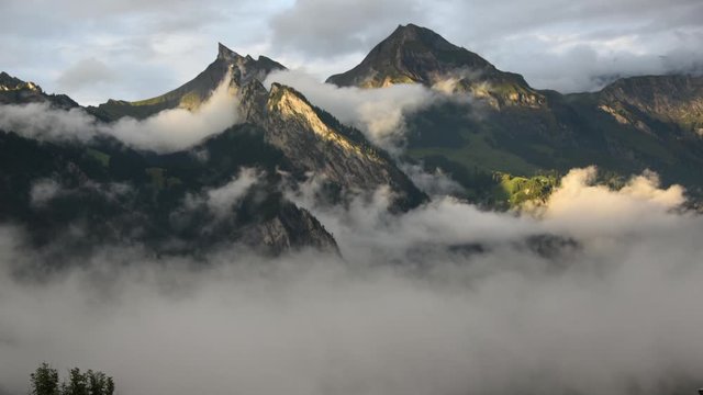 Beautiful Timelapse of Sunset and Clouds Rolling over Mountains - Switzerland