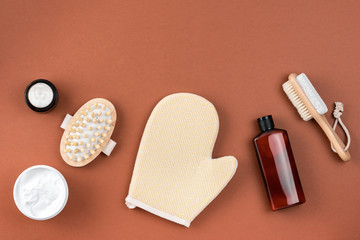Fototapeta na wymiar Cosmetics SPA branding mockup, top view, on brown surface. Bathroom accessory composition.