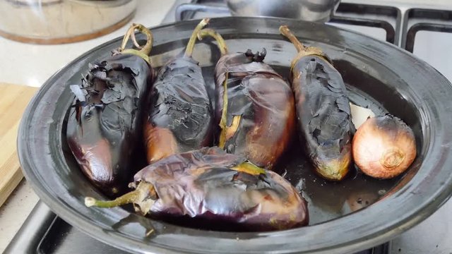 Roasted eggplants on the stove, roasted eggplant.