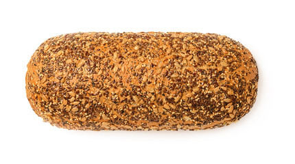 Loaf of fresh bread with seeds isolated on white background. Whole wheat bread with sunflower, flax, poppy and sesame seeds. Baking of dough. Healthy eating.